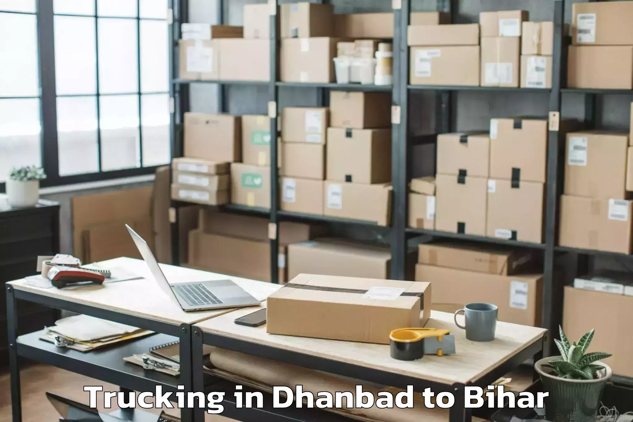 Easy Dhanbad to Lahladpur Trucking Booking